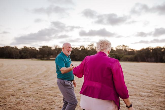 Couple dancing during golden hour family photography session at Perry's Paddock Perth