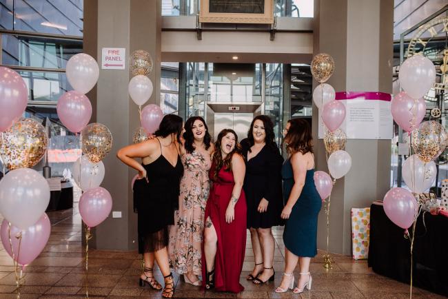 20181202-DSC_2803 Woman and her bridesmaids laughing together in the foyer during Perth events photography session at The Bell Tower Perth