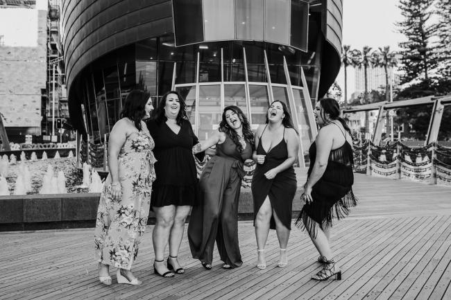 20181202-DSC_2928 Black and white image of women laughing during Perth events photography session at The Bell Tower Perth