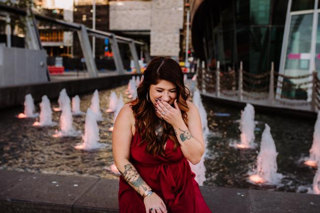 20181202-DSC_2988 Woman laughing and covering her mouth during Perth events photography session at The Bell Tower Perth