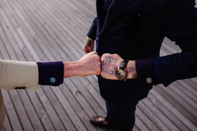 20181202-DSC_3223 Two men holding their fists together during Perth events photography session at The Bell Tower Perth