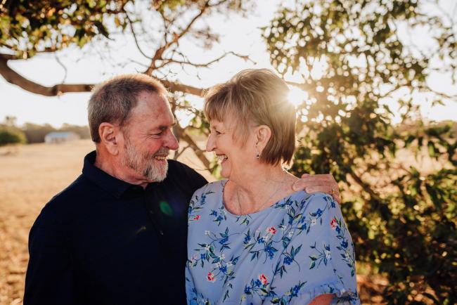 Older couple looking at each other and smiling during an extended family photography session at Perry's Paddock in Perth
