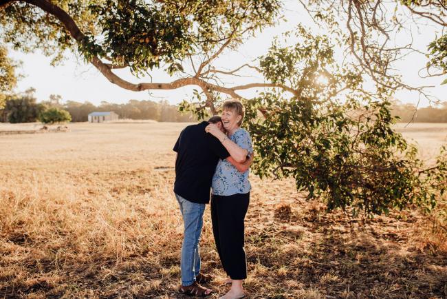 Couple hugging during a Perth family session at Perry's Paddock