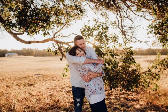 Couple hugging during a Perth family session at Perry's Paddock