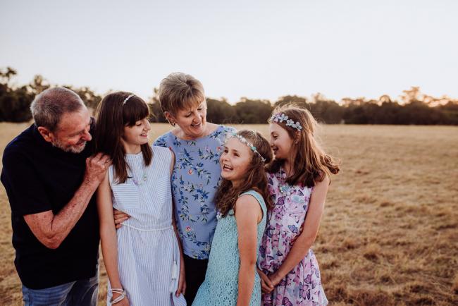 Grandparents with their granddaughters during an extended family photography session at Perry's Paddock in Perth