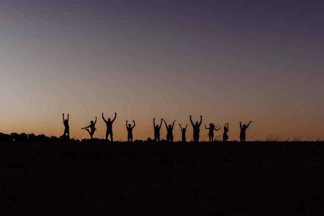 Silhouette group jumping photo during an extended family photography session at Perry's Paddock in Perth