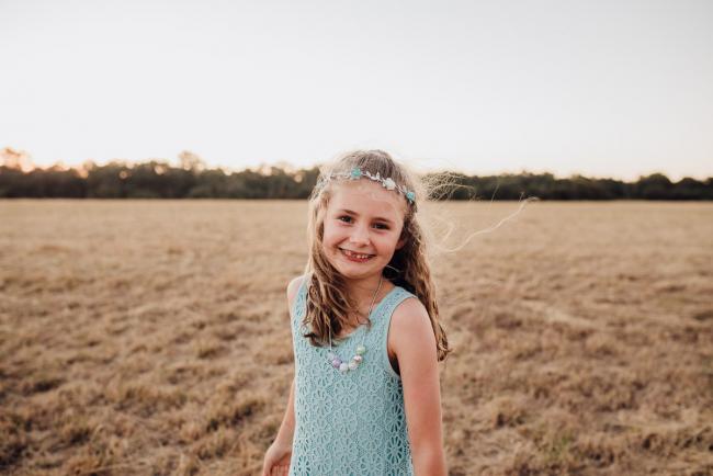 Little girl in an aqua dress during an extended family photography session at Perry's Paddock in Perth
