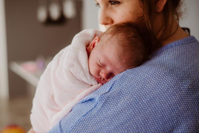 20180720-DSC_9743 New baby sleeps on her mother's shoulder during a newborn lifestyle photography session in Perth