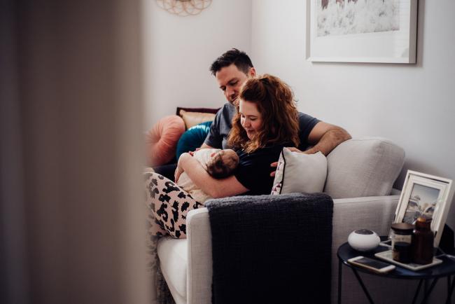 20180927-DSC_8038-1 New parents look adornigly at their new baby during a newborn lifestyle photography session in Perth