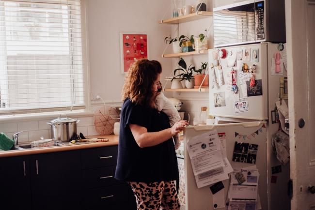 20180927-DSC_8870-1 Mother multi-tasking in the kitchen with her new baby during a Perth newborn photography session