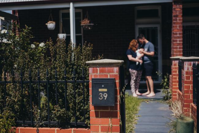 20180927-DSC_8889 New parents stand outside their home with their new baby during Perth newborn photography session