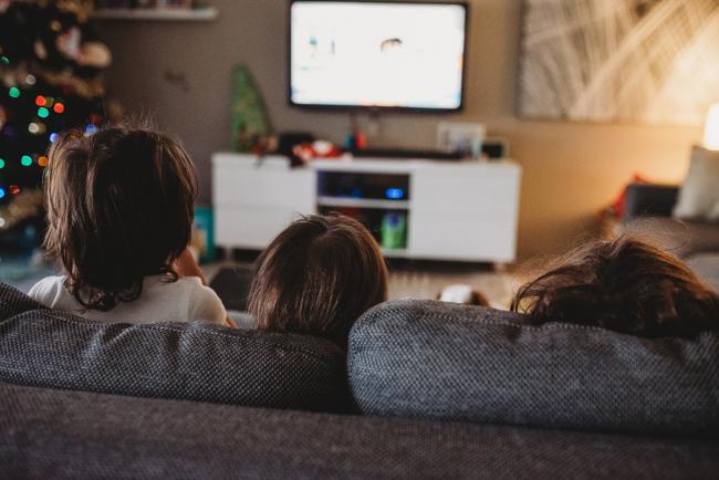 The back of three little boys heads as they sit on the couch with Perth family photographer