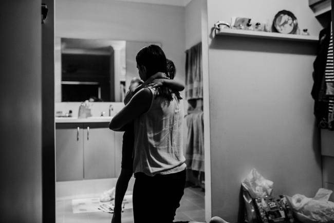 Black and white image by mother and son cuddling by Perth family photographer