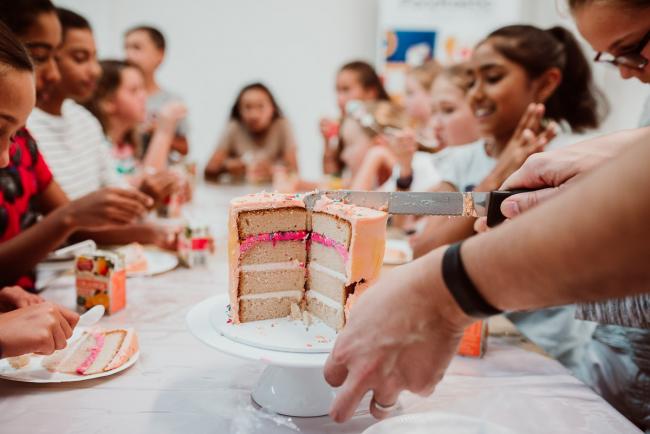 Family-Photography-Perth-24-of-25 Cake sliced in half during a Birthday party at Cakes Tinz 'n' Thingz with Perth family photographer