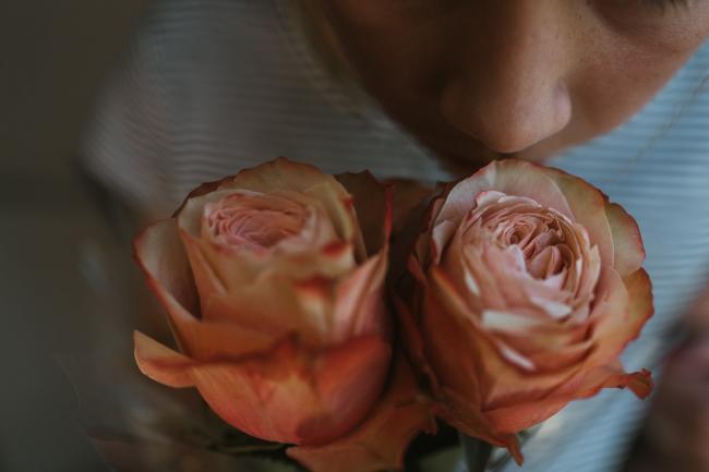 Family-Photography-Perth-3-of-25 Close up of girl smelling roses with Perth family photographer