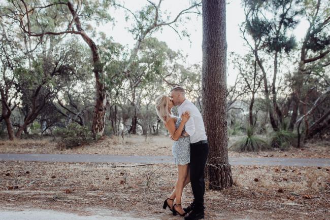 Perth-Couples-Photography-17-of-27 Full body image of a couple kissing at The Pines Wanneroo during a Golden Hour Perth couples photography session