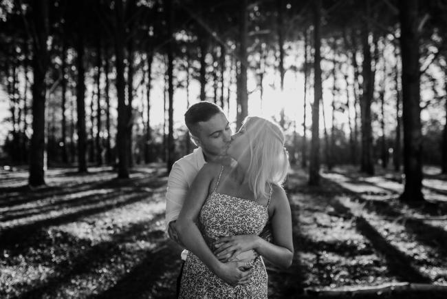 Perth-Couples-Photography-6-of-27 Black and white image of a couple kissing at The Pines Wanneroo during a Golden Hour Perth couples photography session