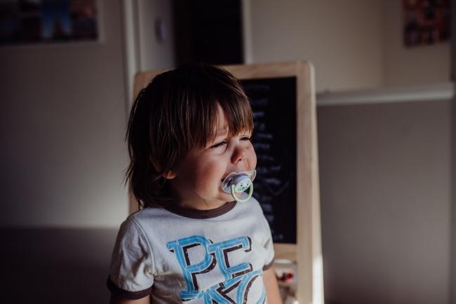 Perth-Family-Photographer-10-of-26 Little boy crying with a dummy in his mouth with Perth family photographer