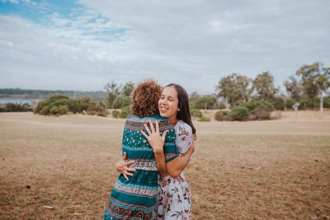 Older daughter and mother hugging during a Perth extended family photography session
