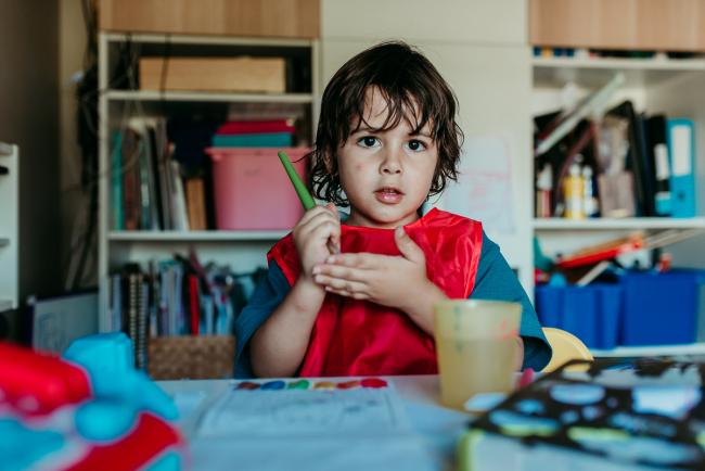 Perth-Family-Photographer-16-of-26 Little boy wearing a red art smock and painting with Perth family photographer