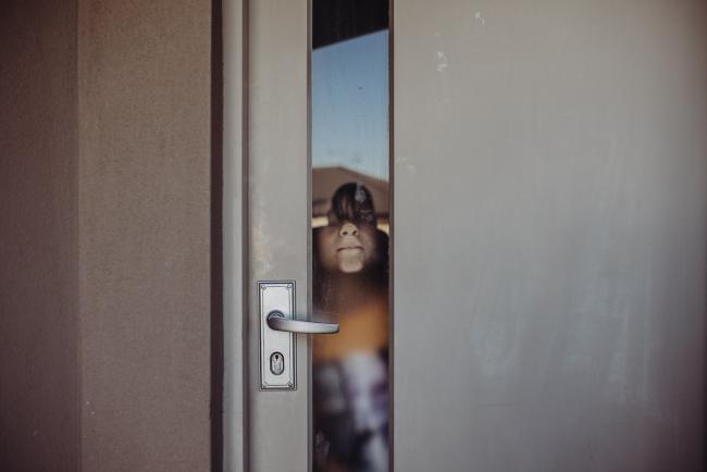 Perth-Family-Photographer-17-of-26 Boy with his face pressed up against the window with Perth family photographer