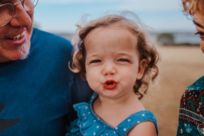 Little girl pulling a funny face at the camera during a Perth extended family photography session