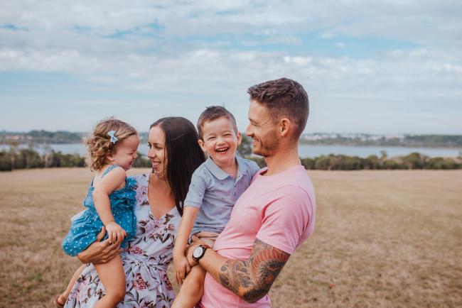 Family of 4 laughing together during an extended Perth family photography session