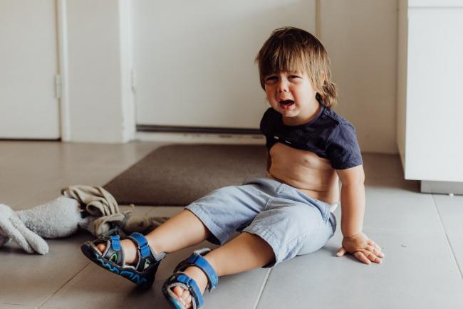 Perth-Family-Photographer-4-of-26 Little boy sitting on the ground crying with Perth family photographer