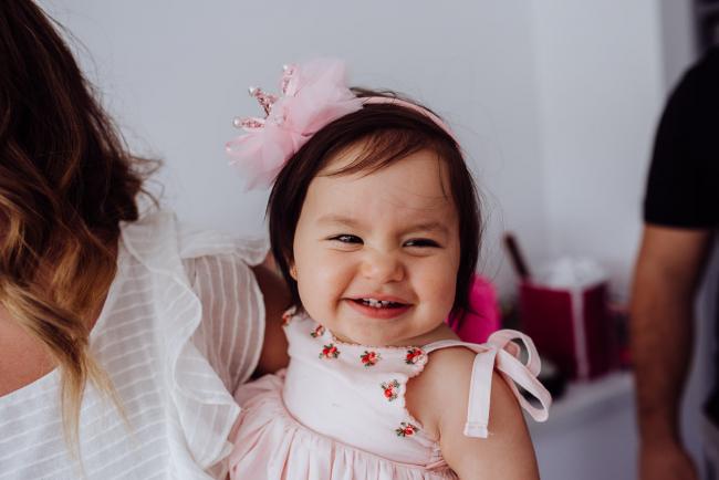 Little girl smiling during a birthday party captured by Perth events photographer