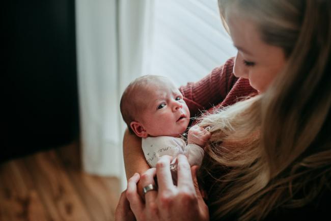 Newborn-Photographer-Perth-3-of-37 Newborn baby playing with her mothers hair with Perth lifestyle newborn photographer
