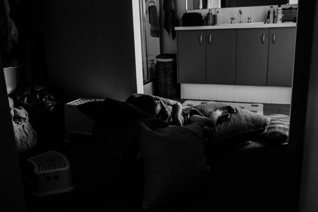 20190407-DSC_0327 Black and white image of boy sitting on cushions outside the toilet with Perth family photographer