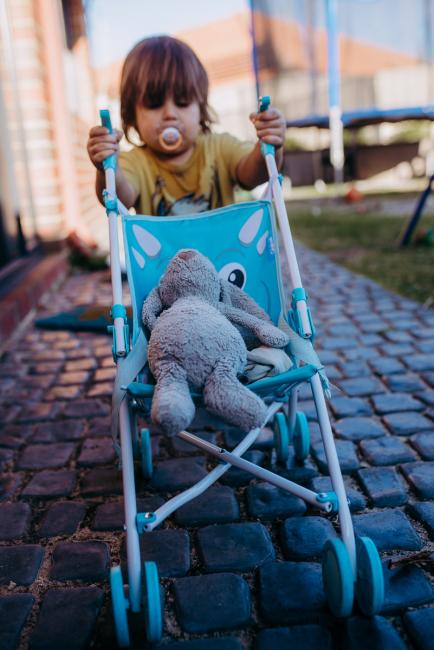 20190408-DSC_0410 Little boy pushing his bunnies in the stroller with Perth family photographer