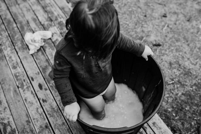 20190416-DSC_1698 Black and white top down image of a boy in a bucket of soapy water with Perth family photographer