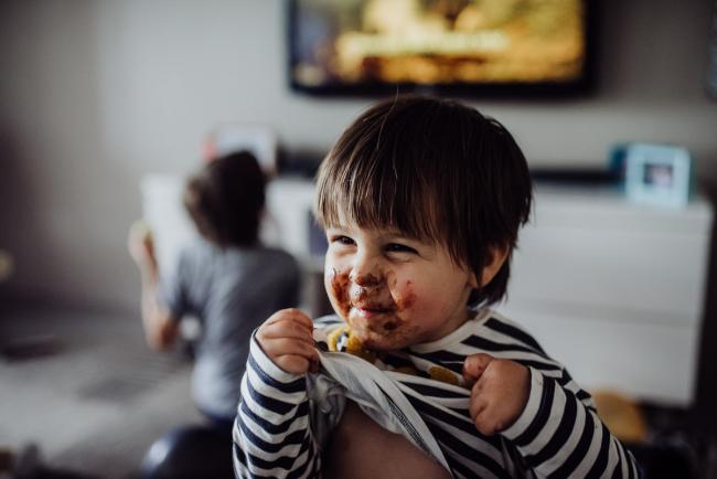 20190420-DSC_1776 Little boy laughing with chocolate around his mouth with family photographer Perth