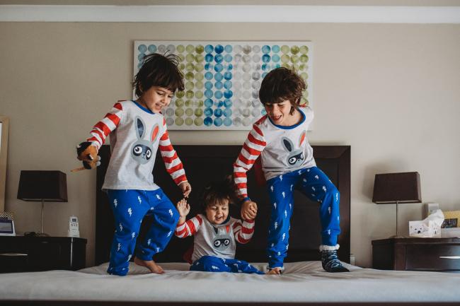 20190422-DSC_2305 Boys jumping on the bed as one falls down with family photographer Perth