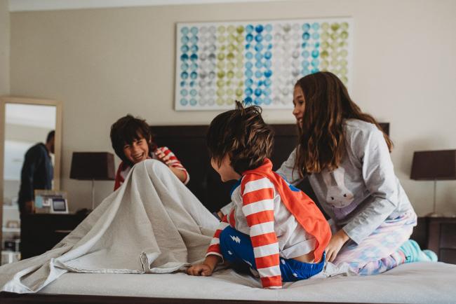 20190422-DSC_2457 Kids laughing on the bed as the youngest is under the sheet with family photographer Perth
