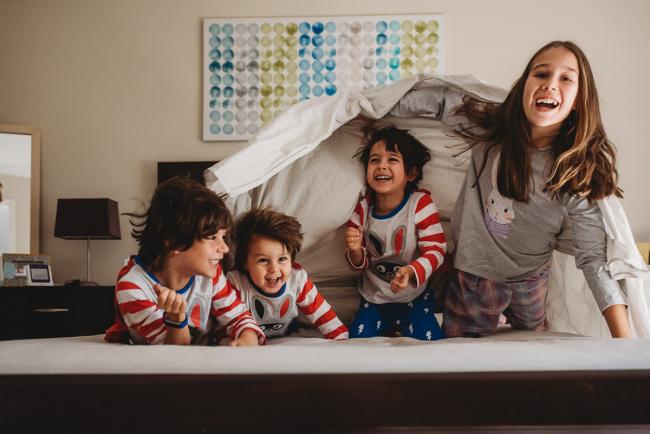 20190422-DSC_2469 Four kids jumping out from the bed under a sheet with family photographer Perth