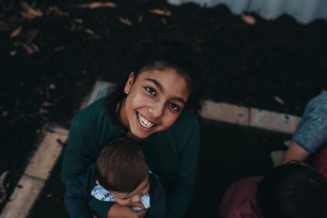 20190422-DSC_2679 Girl smiling up at the camera with Perth family photographer