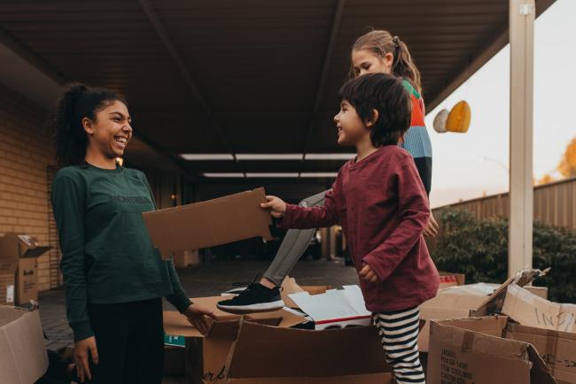 20190422-DSC_3028 Boy pointing a cardboard box at a girl with Perth family photographer