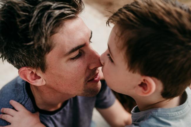 Family-Photographer-Perth-The-Pines-15-of-21 Father and son nose kisses during a Family photographer session at The Pines in Wanneroo