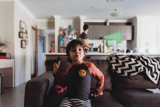 Little boy sitting on the couch with Family Photographer Perth