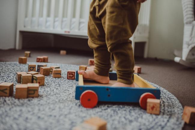 Little boys feet standing in a trolley surrounded by blocks with Perth family photographer