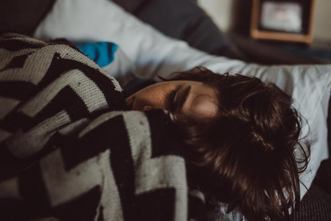 Close up of boy laying on the couch with a blanket with Perth family lifestyle photographer