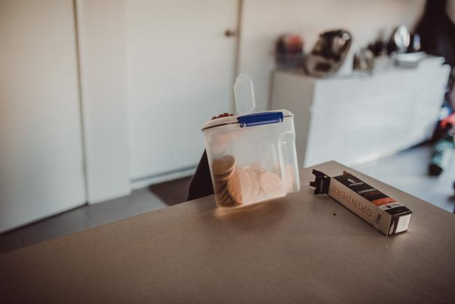 Little hand reaching up to get the biscuit box with Family photographer Perth