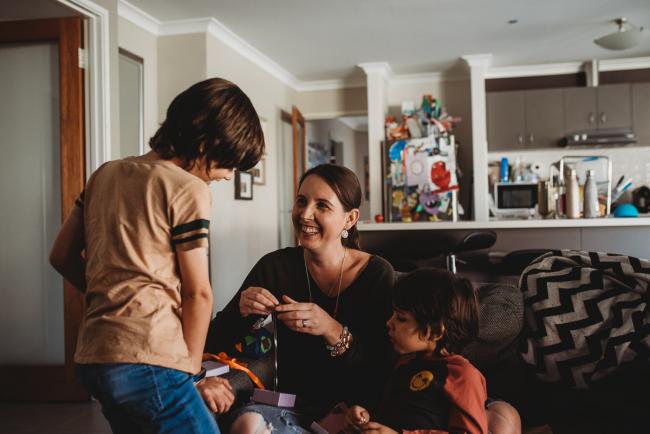 Mother laughing at her son with Family Photographer Perth