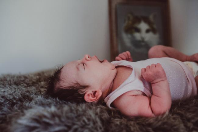 Newborn-Lifestyle-Photographer-Perth-1-of-54 Newborn baby laying on a rug and yawning during a lifestyle newborn photography session in Perth