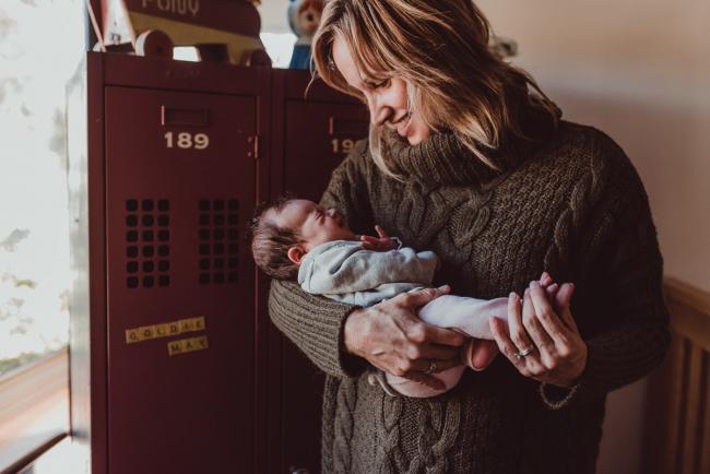 Newborn-Lifestyle-Photographer-Perth-2-of-54 Mother holding her newborn baby during a lifestyle newborn photography session in Perth