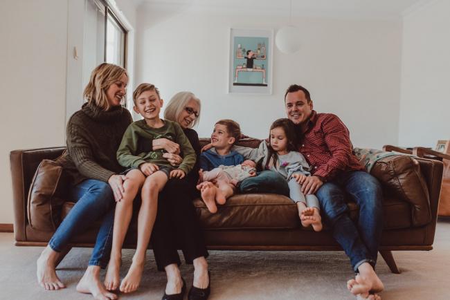Newborn-Lifestyle-Photographer-Perth-31-of-54 Family and grandmother sitting on the couch during a lifestyle newborn photography session in Perth