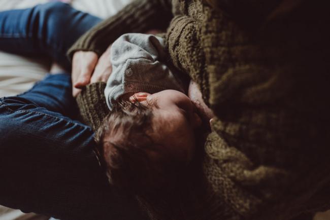 Newborn-Lifestyle-Photographer-Perth-48-of-54 Mother breastfeeding during a lifestyle newborn photography session in Perth