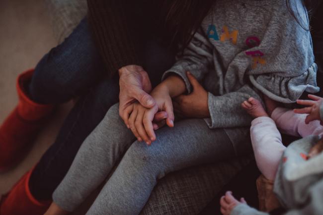 Newborn-Lifestyle-Photographer-Perth-54-of-54 Mother holding the hand of her daughter during a lifestyle newborn photography session in Perth